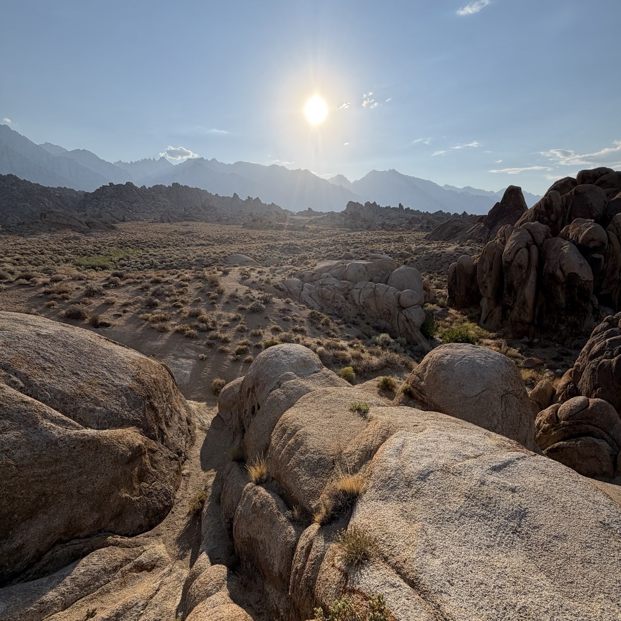Late-afternoon sun over the Sierra Nevada crest from the granite boulders of the Alabama Hills along Movie Road, Lone Pine
