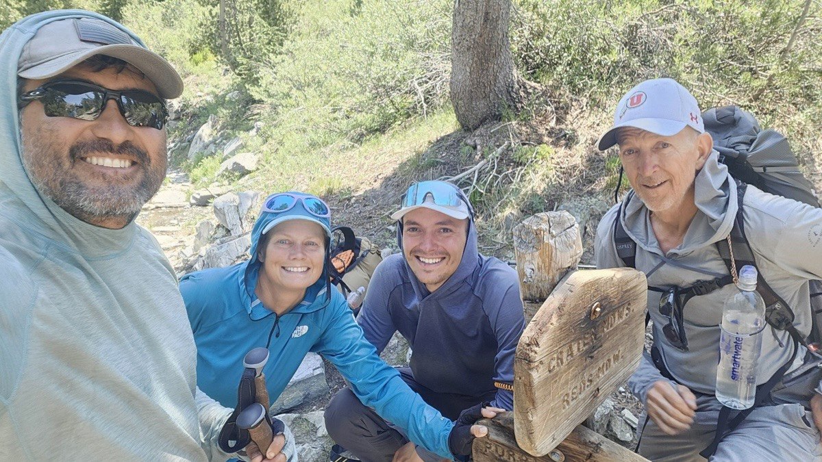 Four thru-hikers together at the Duck Pass trail junction on the John Muir Trail, the last photo before one of them left the trail