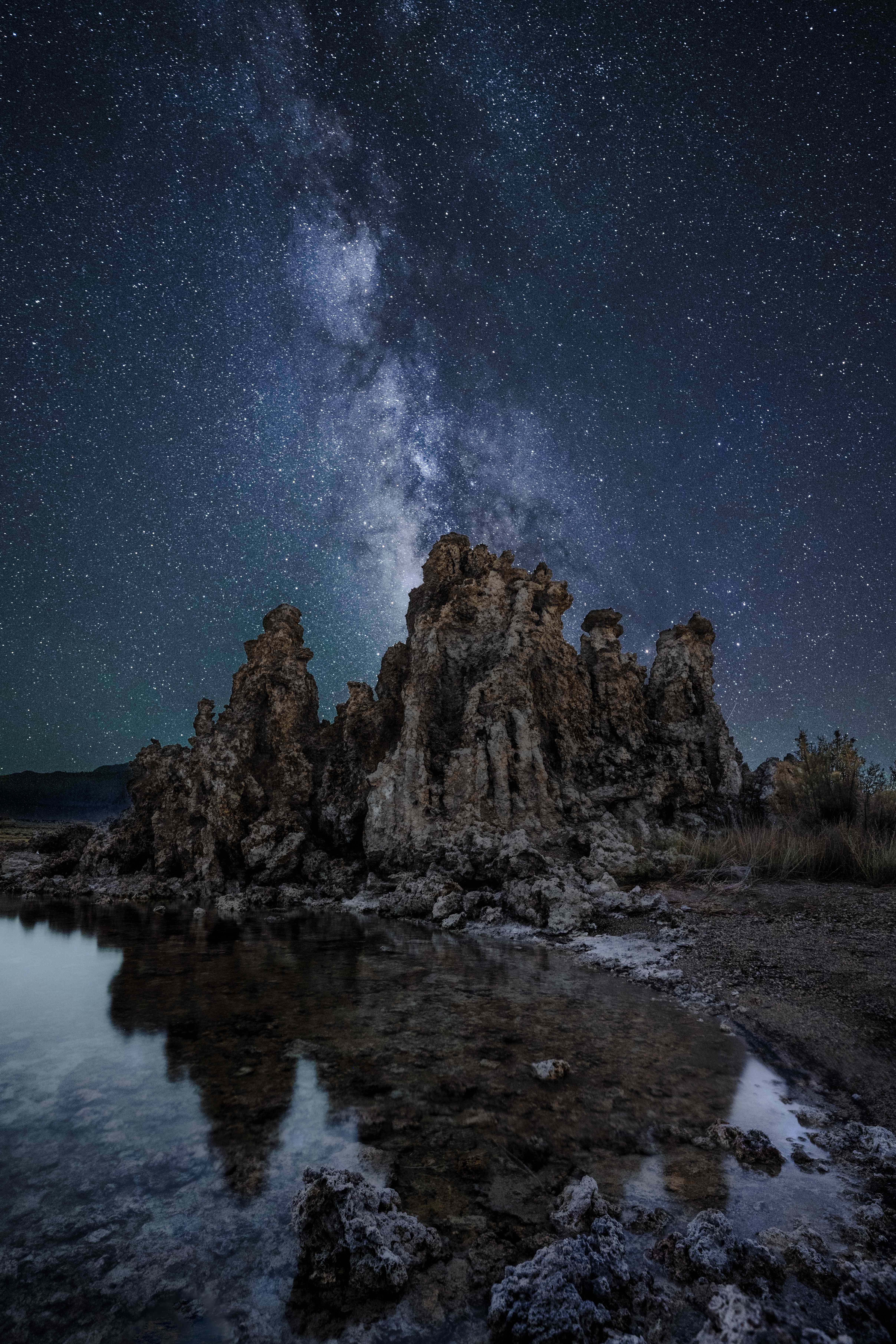 The Milky Way over the tufa towers of South Tufa, Mono Lake, during the Perseid meteor shower, reflected in still water.